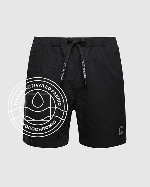 The Psycho Bunny MENS BIG AND TALL SAMOS HYDROCHROMIC SWIM TRUNK (B9W453F200) features black quick-dry fabric, a drawstring waistband, subtle pattern, small leg logo, and "Water Activated Fabric Hydrochromic" circular graphic. Shown on grey background.