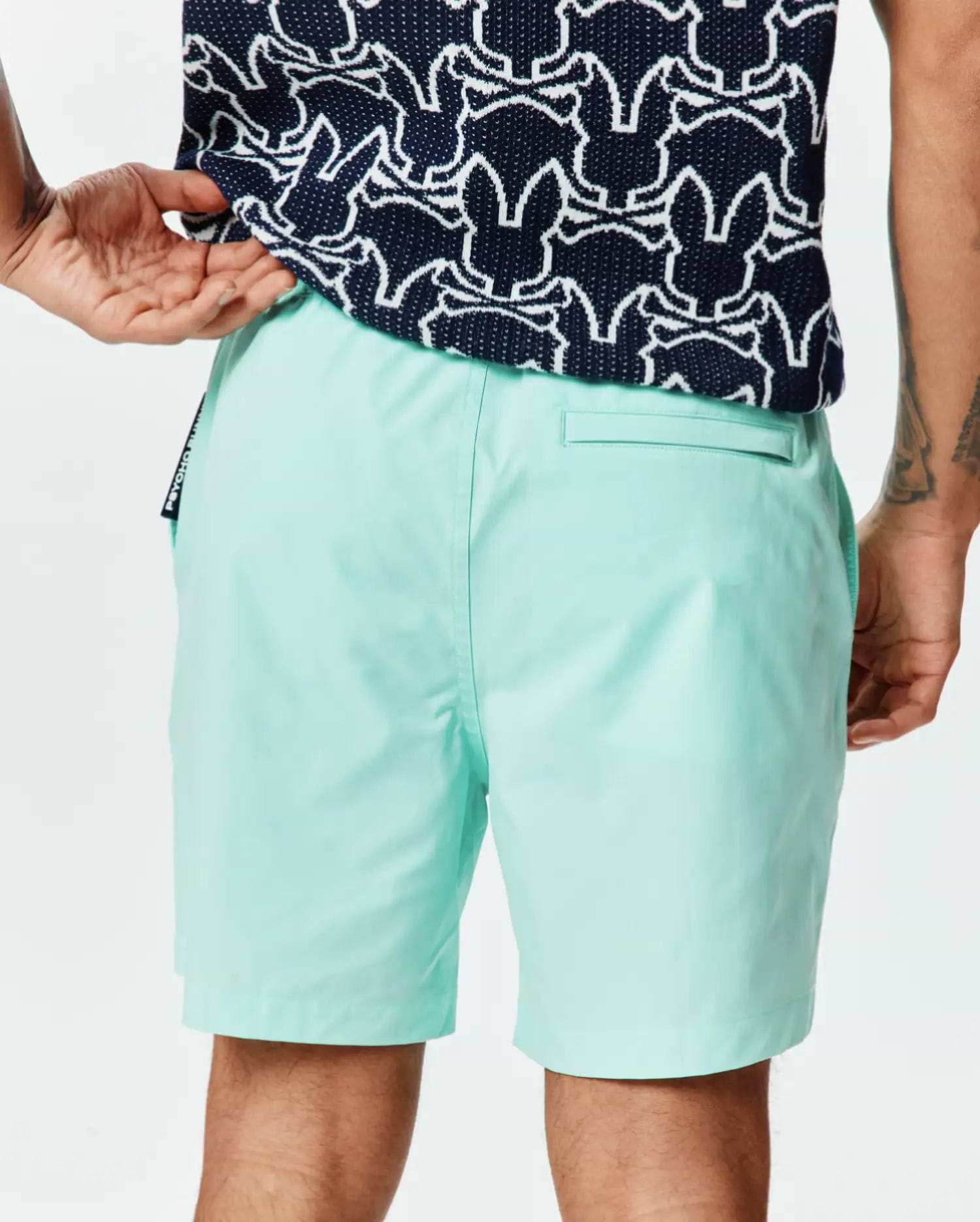 Mens Samos Hydrochromic Printed Swim Trunk 6 in mint green, featuring a smooth quick-dry fabric, classic fit, back welt pocket, and a small Psycho Bunny side seam tag.