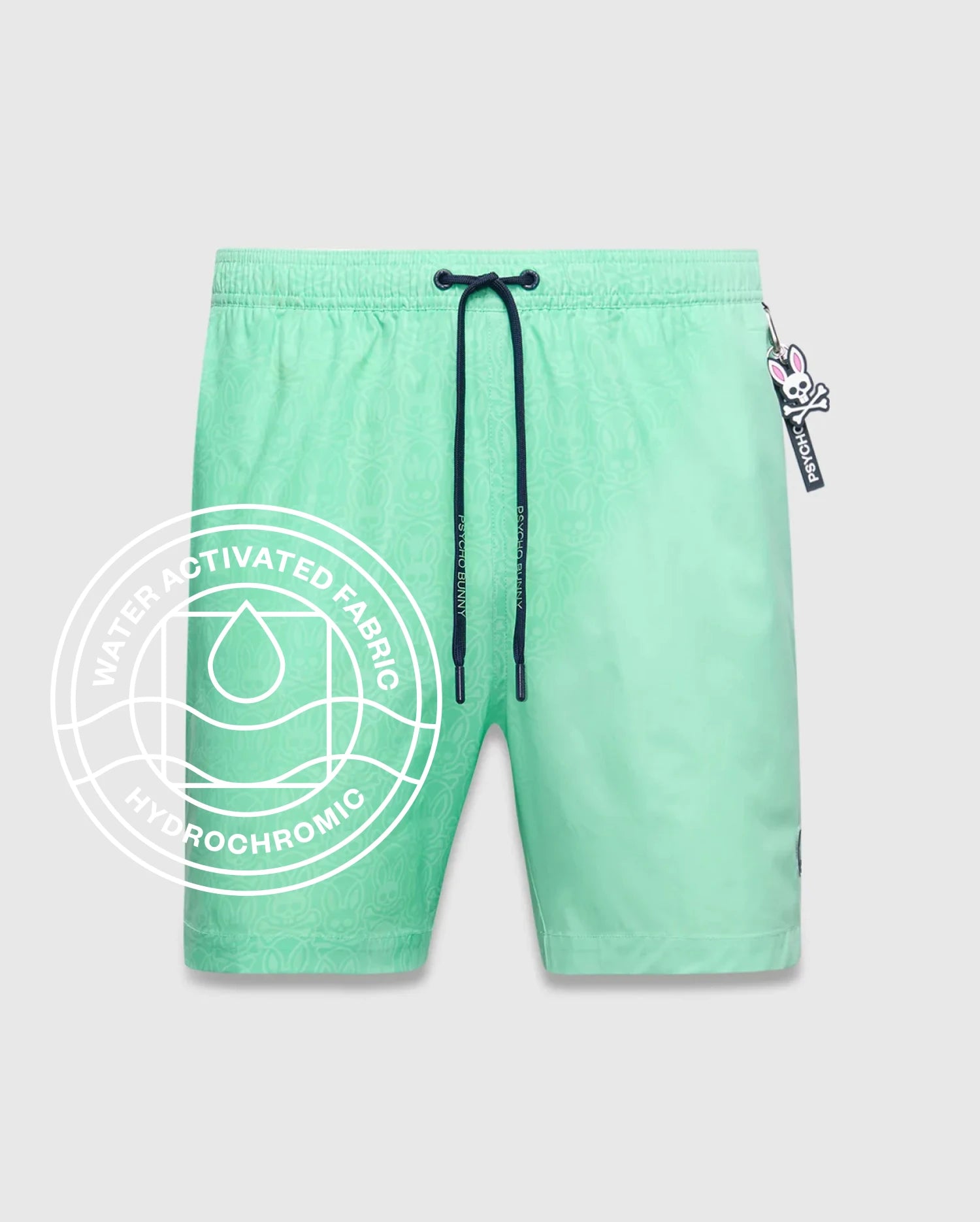 Mens Samos Hydrochromic Printed Swim Trunk 6 in mint green, featuring a subtle hydrochromic bunny skull pattern, dark blue drawstring with Psycho Bunny tips, and an elastic waistband.