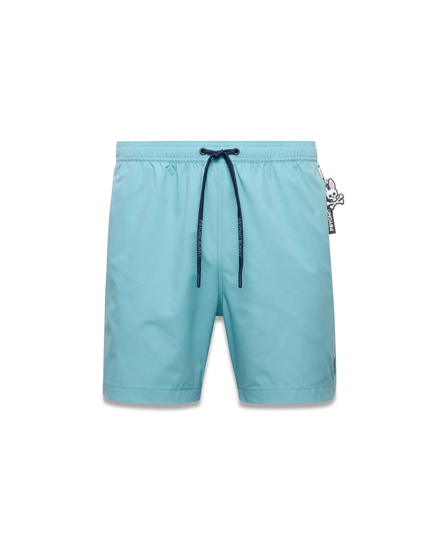 Mens Samos Hydrochromic Swim Trunks in light blue, with dark blue drawstring, Psycho Bunny logo tips, an embroidered skull logo on the left leg, and a Psycho Bunny skull logo tag on the right hip. (1)