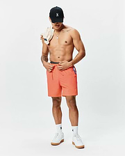 Mens Samos Hydrochromic Printed Swim Trunk in coral, with a navy/white striped waistband, white drawstring, small embroidered Psycho Bunny skull on the left leg, and a side Psycho Bunny tag, offering a relaxed fit. (6)