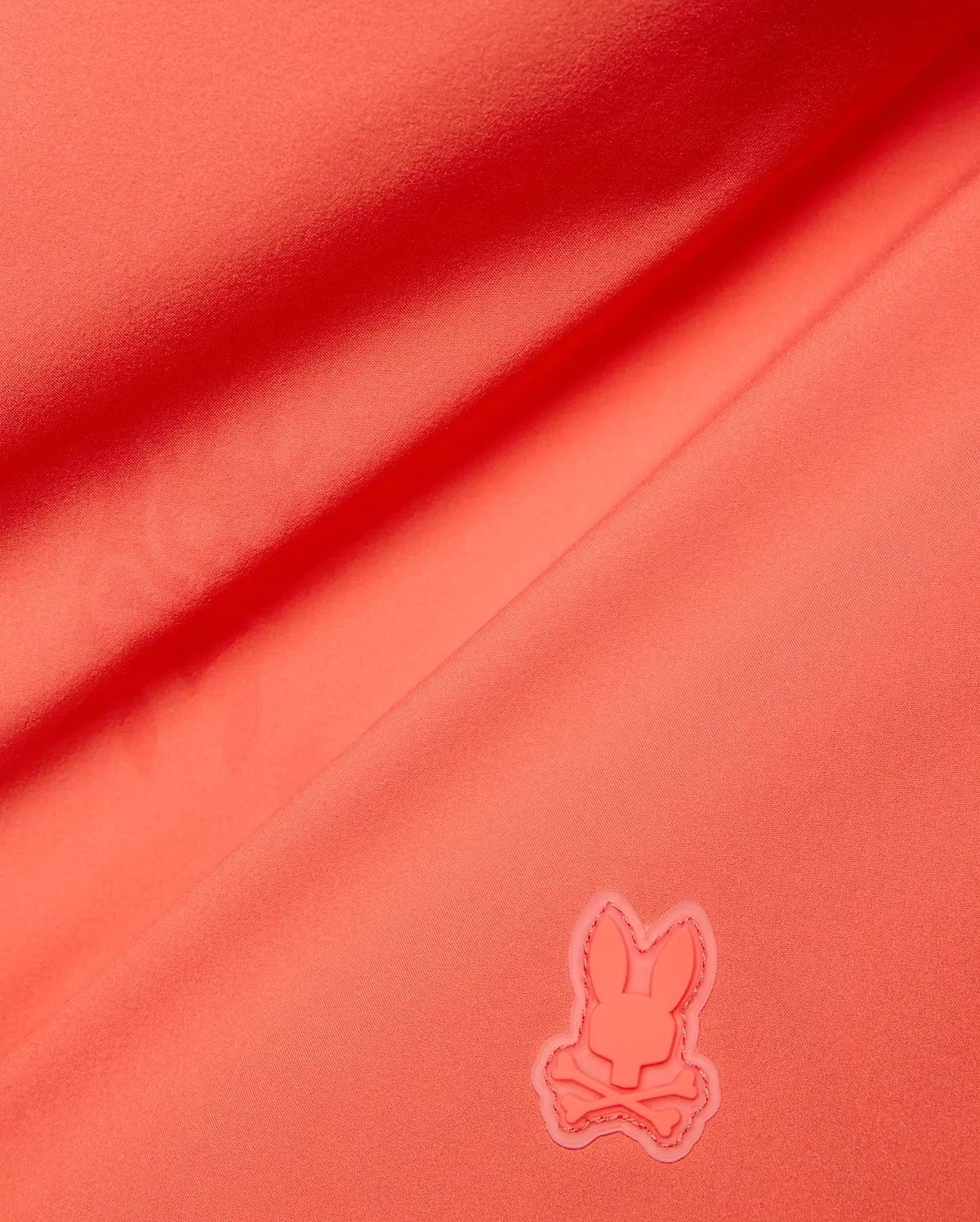 Vibrant Coral Mens Samos Hydrochromic Printed Swim Trunk, crafted from smooth premium swimwear fabric, featuring a raised tonal rubberized Psycho Bunny skull logo. (7)