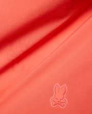 Vibrant Coral Mens Samos Hydrochromic Printed Swim Trunk, crafted from smooth premium swimwear fabric, featuring a raised tonal rubberized Psycho Bunny skull logo. (7)