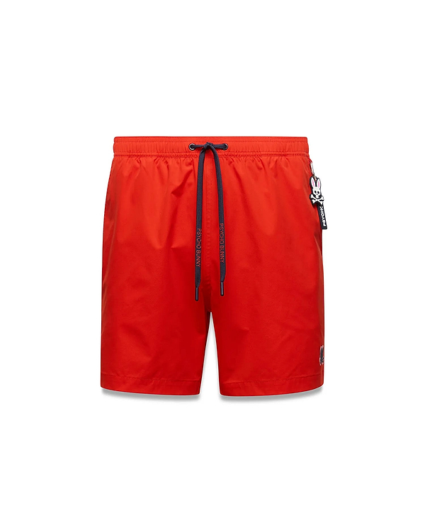 Mens Samos Hydrochromic Printed Swim Trunk in vibrant red, classic fit, smooth fabric, navy drawstring with Psycho Bunny text, small embroidered bunny skull logo, and a Psycho Bunny keychain.