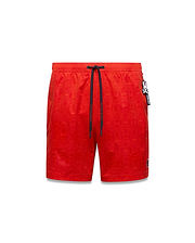Mens Samos Hydrochromic Printed Swim Trunk, vibrant red with an all-over subtle bunny skull print, dark blue Psycho Bunny drawstrings, small embroidered logo, and a detachable charm.