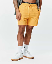 Mens Samos Hydrochromic Printed Swim Trunk in vibrant yellow, featuring a relaxed fit, drawstring waist, smooth quick-dry fabric, and a small black and white Psycho Bunny logo tag on the right pocket. (2)