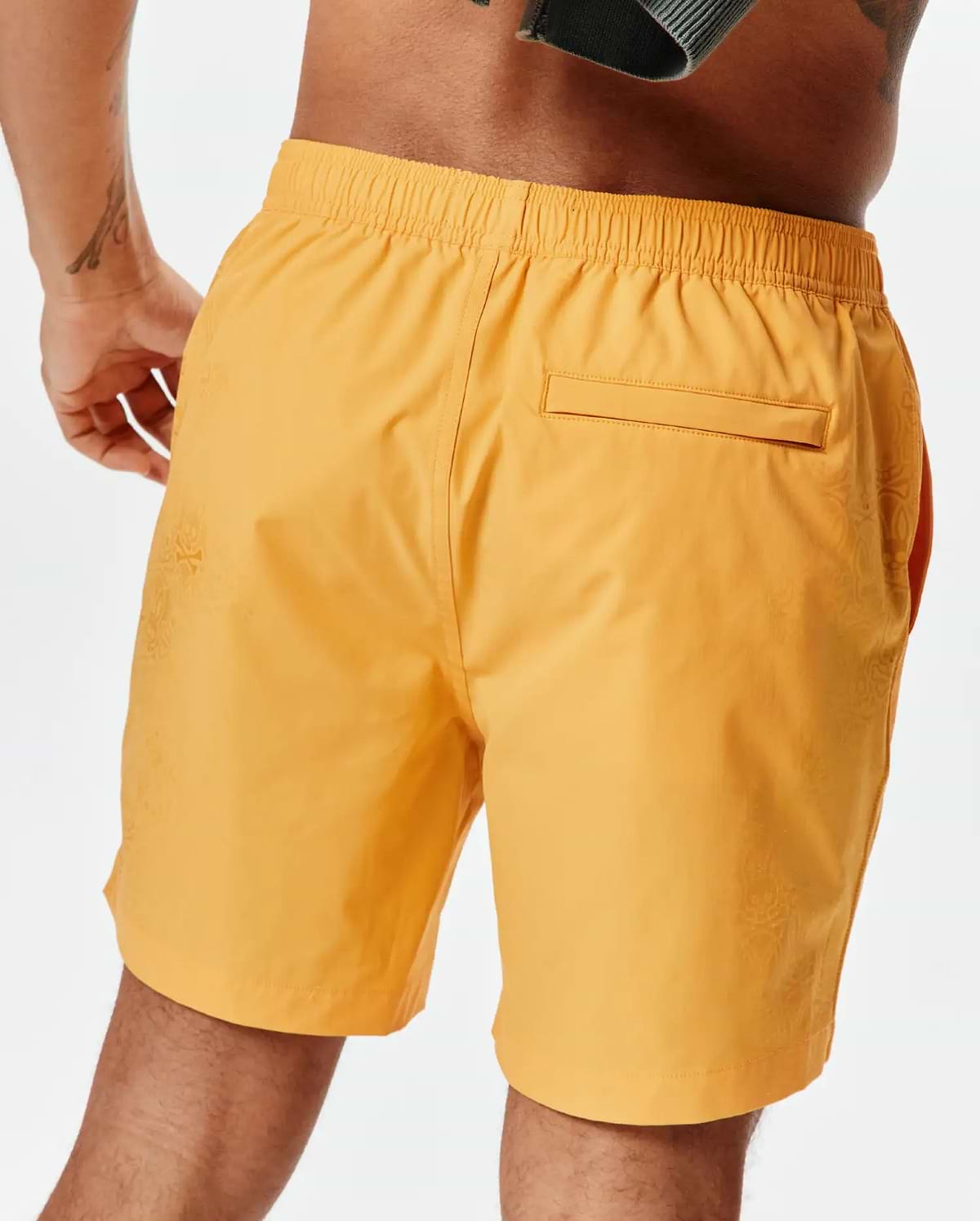Marigold Mens Samos Hydrochromic Printed Swim Trunk with a relaxed fit, elastic waistband, and a subtle tonal Psycho Bunny skull pattern on the side, featuring a back flap pocket. (4)