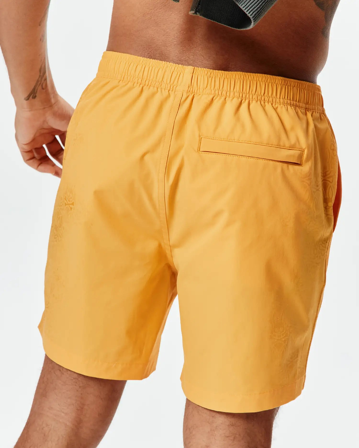 Marigold Mens Samos Hydrochromic Printed Swim Trunk with a relaxed fit, elastic waistband, and a subtle tonal Psycho Bunny skull pattern on the side, featuring a back flap pocket. (4)