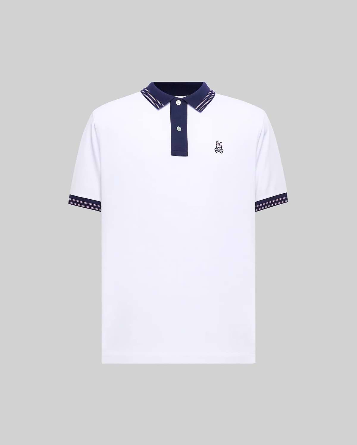 Mens Big And Tall Kenyon Lightweight Pique Polo in white, featuring a navy blue collar with red stripes, two-button placket, and ribbed cuffs with red stripes. Small embroidered Psycho Bunny logo on left chest. (1)