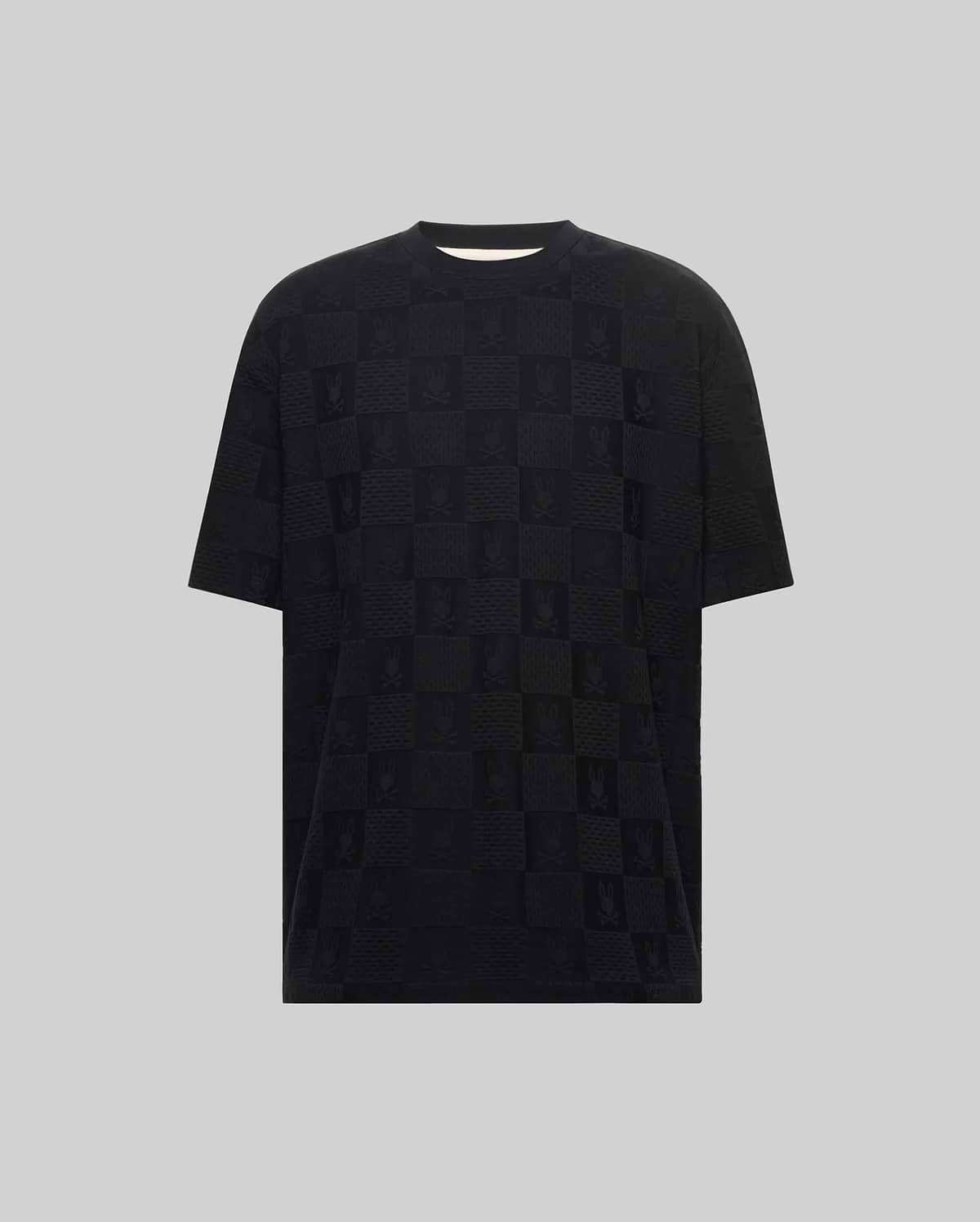 Mens Big And Tall Dustin Oversized Fit Tee, a black jacquard knit t-shirt featuring an all-over tonal checkerboard pattern with alternating Psycho Bunny skull logos and textured squares.