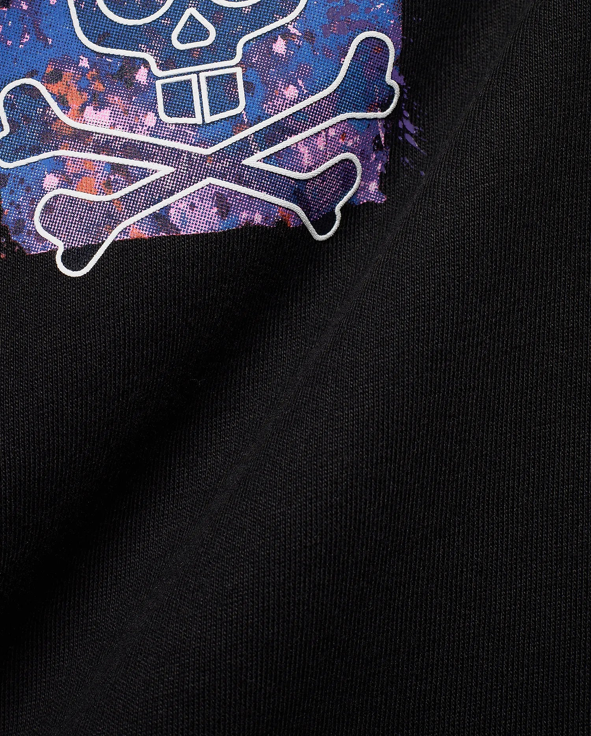 Black jersey Mens Big And Tall Isaac Splatter Back Graphic Tee featuring a large, vibrant blue, purple, pink, and orange splatter skull and crossbones graphic outlined in white.