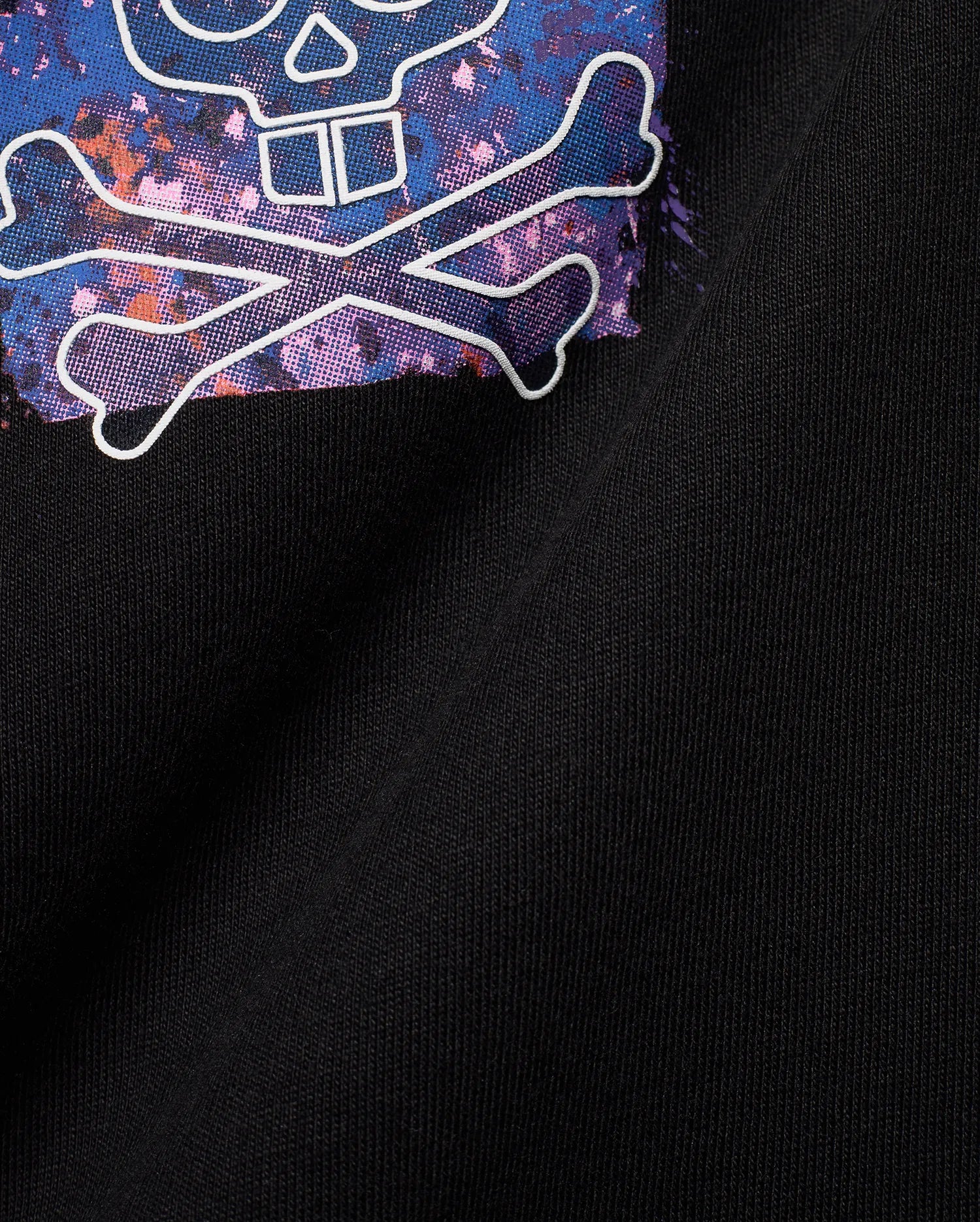Black jersey Mens Big And Tall Isaac Splatter Back Graphic Tee featuring a large, vibrant blue, purple, pink, and orange splatter skull and crossbones graphic outlined in white.