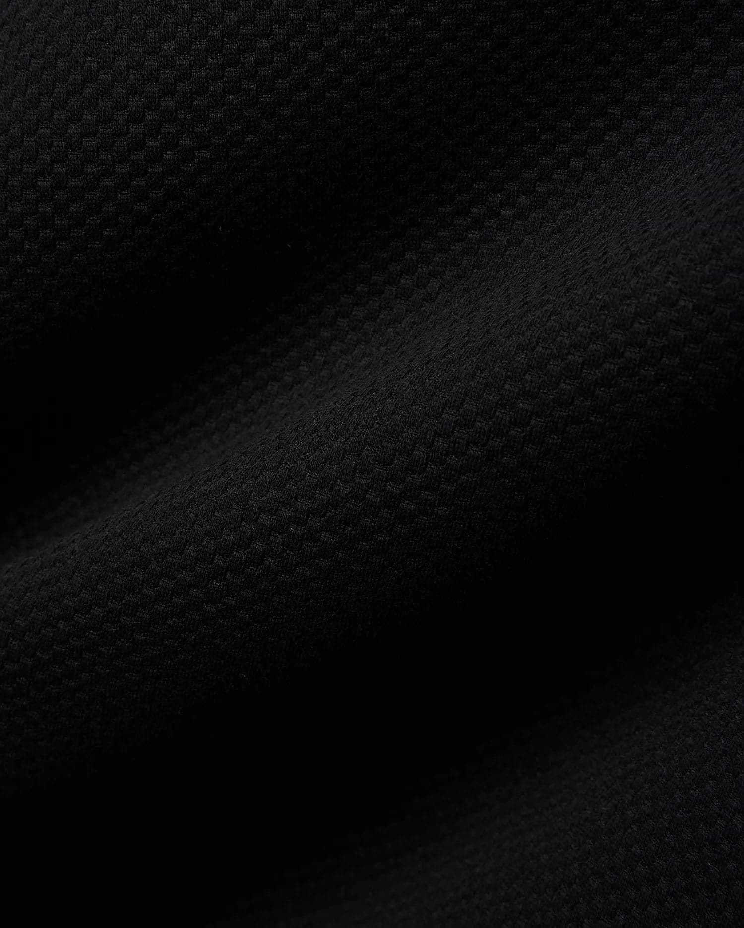 Mens Big And Tall Marc Textured 1/4 Zip in rich black, featuring a luxurious, finely detailed geometric pique knit fabric, embodying Psycho Bunny's refined streetwear aesthetic.