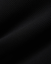Mens Big And Tall Marc Textured 1/4 Zip in rich black, featuring a luxurious, finely detailed geometric pique knit fabric, embodying Psycho Bunny's refined streetwear aesthetic.