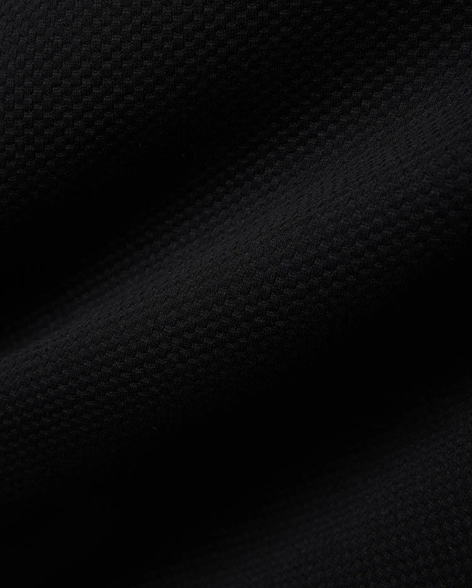 Mens Big And Tall Marc Textured 1/4 Zip in rich black, featuring a luxurious, finely detailed geometric pique knit fabric, embodying Psycho Bunny's refined streetwear aesthetic.