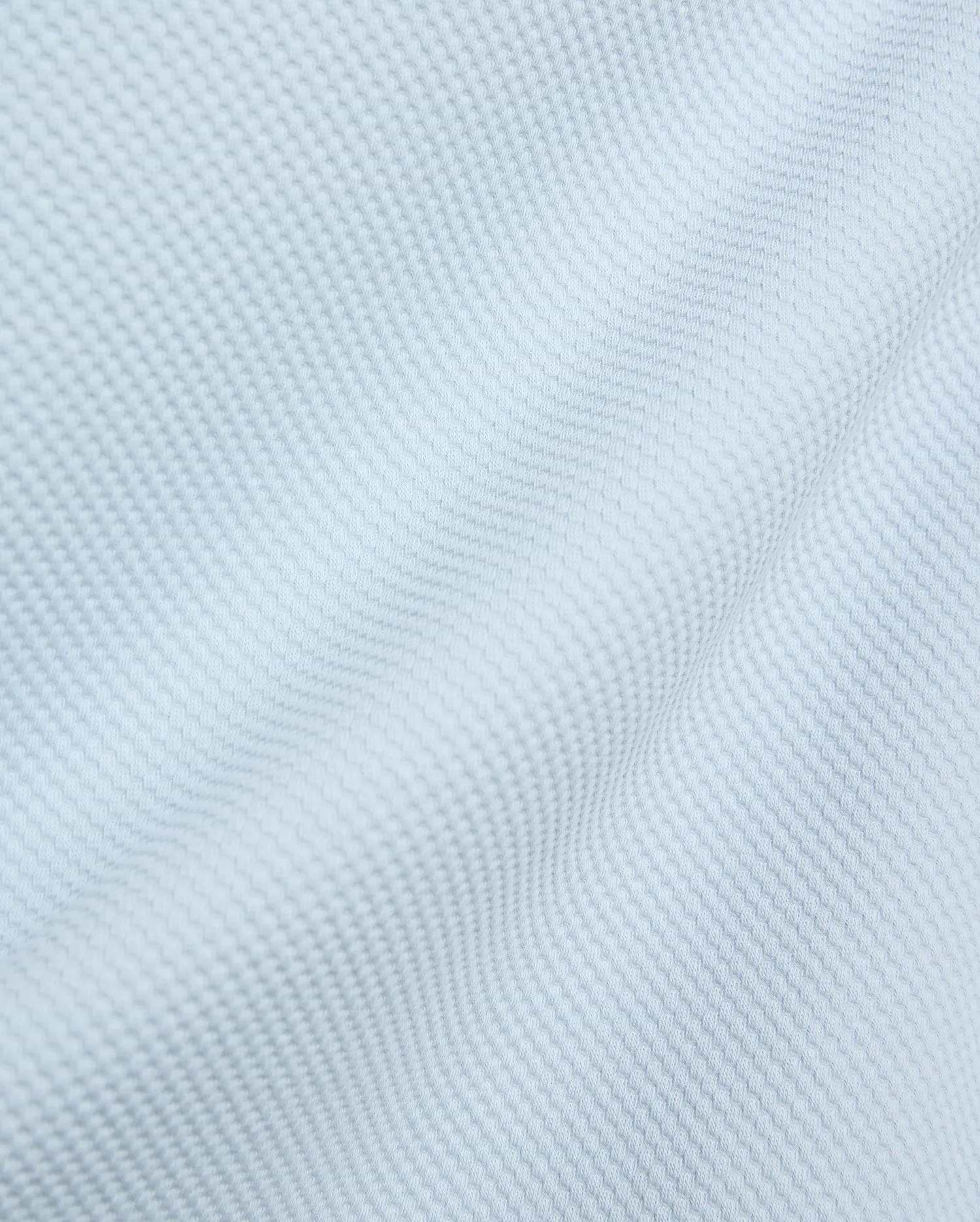 Mens Big And Tall Marc Textured 1/4 Zip in a soft, pale light blue, showcasing a refined, subtly raised pique knit fabric with a uniform, small square pattern.