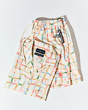 Mens Atlas Tencel Shirt and matching relaxed fit shorts in cream with a multicolor wavy plaid pattern featuring small repeated pink bunny skull logos, plus a Psycho Bunny drawstring and keychain.