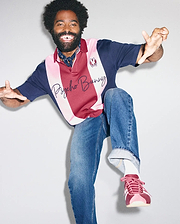Mens Chad Relaxed Fit Striped Polo in navy, pink, and burgundy jersey knit, featuring vertical stripes, a small embroidered bunny skull on the left chest, and large script Psycho Bunny text across the front.