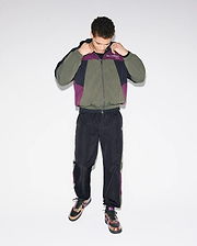 Olive, black, and purple colorblock crinkled nylon windbreaker jacket with Psycho Bunny chest text logo, paired with matching Mens Alder Nylon Colorblock Pant featuring side stripes and an embroidered bunny skull.