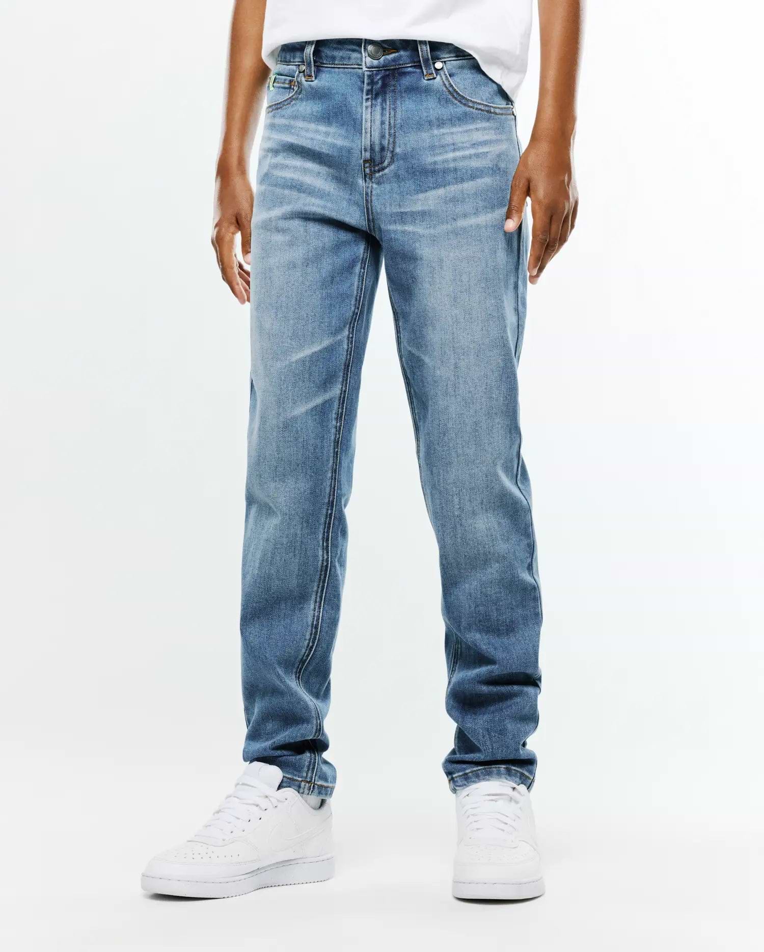 Kids Emerson Denim Pant in a classic straight fit, featuring a medium blue wash with subtle fading, whiskering, and a traditional five-pocket design.