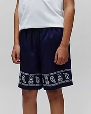 Kids Luke Tencel Short, navy blue with a white bandana-style print featuring Psycho Bunny skull logos, paisley motifs, and PSYCHO BUNNY text along the hem, in a relaxed fit.