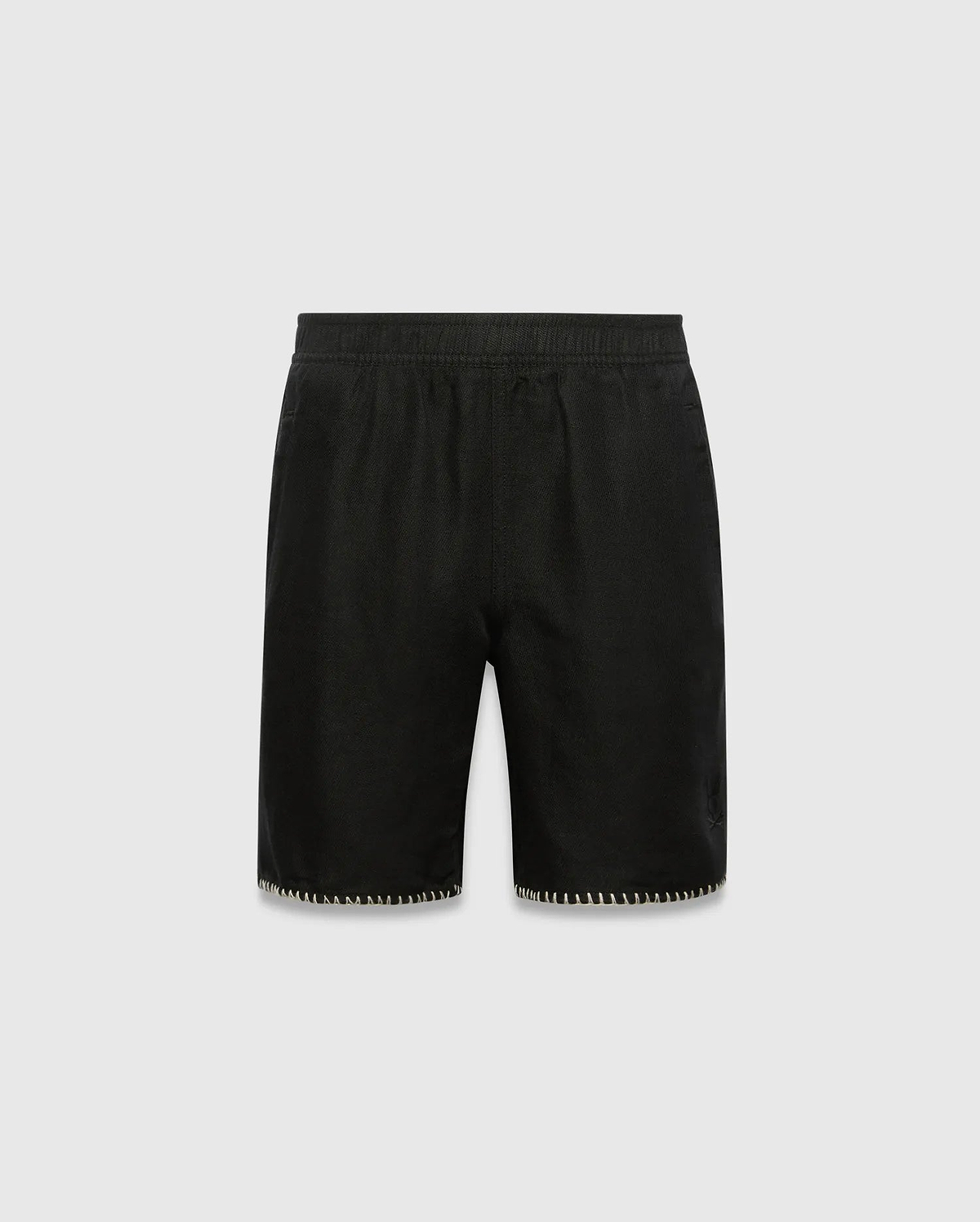 Kids Brad Linen Short, black relaxed fit with linen texture, featuring a subtle tonal embroidered Psycho Bunny skull logo on the lower right leg and white contrast blanket stitching on the hem.