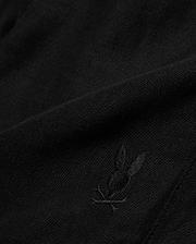 Kids Brad Linen Short in classic black, crafted from a breathable linen blend with a subtle woven texture, featuring a small, tonal embroidered Psycho Bunny skull logo.