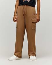 Camel brown French terry Kids Nash Cargo Sweatpant with a relaxed wide-leg fit, drawstring waist with black tips, a cargo pocket, and a small embroidered Psycho Bunny skull logo on the right thigh.
