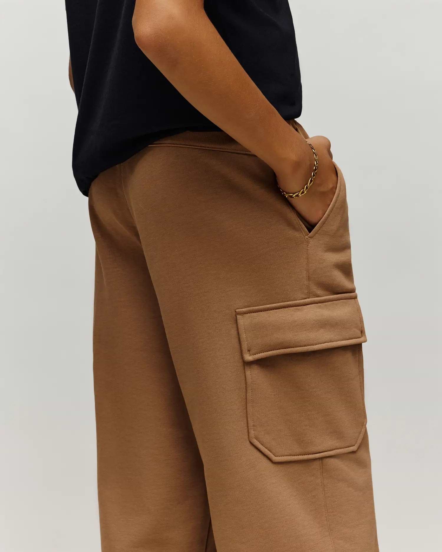 Psycho Bunny Kids Nash Cargo Sweatpant in camel brown, featuring a relaxed fit, soft French terry fabric, and a prominent cargo pocket on the side.