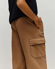 Psycho Bunny Kids Nash Cargo Sweatpant in camel brown, featuring a relaxed fit, soft French terry fabric, and a prominent cargo pocket on the side.