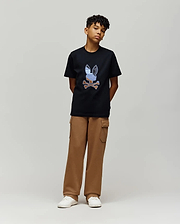Black jersey t-shirt with a large, multi-color embroidered Psycho Bunny skull logo on the chest, paired with relaxed fit brown French terry Kids Nash Cargo Sweatpant featuring side cargo pockets.