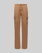 Kids Nash Cargo Sweatpant in camel brown french terry, featuring a relaxed fit, drawstring waist, two cargo pockets, and a small tonal embroidered Psycho Bunny skull logo on the right thigh.