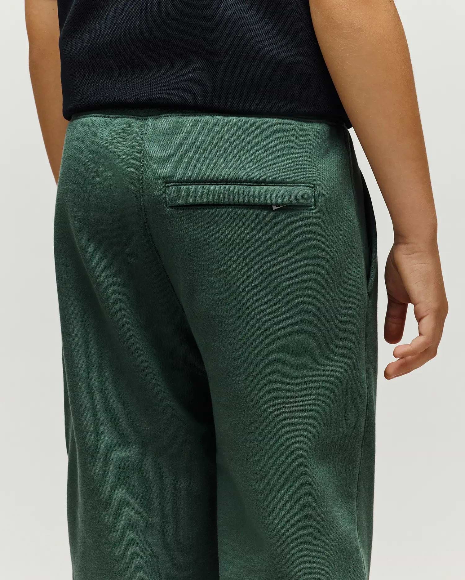 Kids Tate Chenille Sweatpant in deep forest green, featuring a relaxed fit, soft chenille knit texture, elasticated waist, and a small Psycho Bunny logo tag on the back right welt pocket.