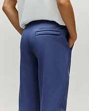 Kids Indigo Ski Bunny Sweatpant in indigo blue, crafted from soft french terry with a relaxed fit, featuring an embroidered Psycho Bunny text logo above a back welt pocket and convenient side pockets.