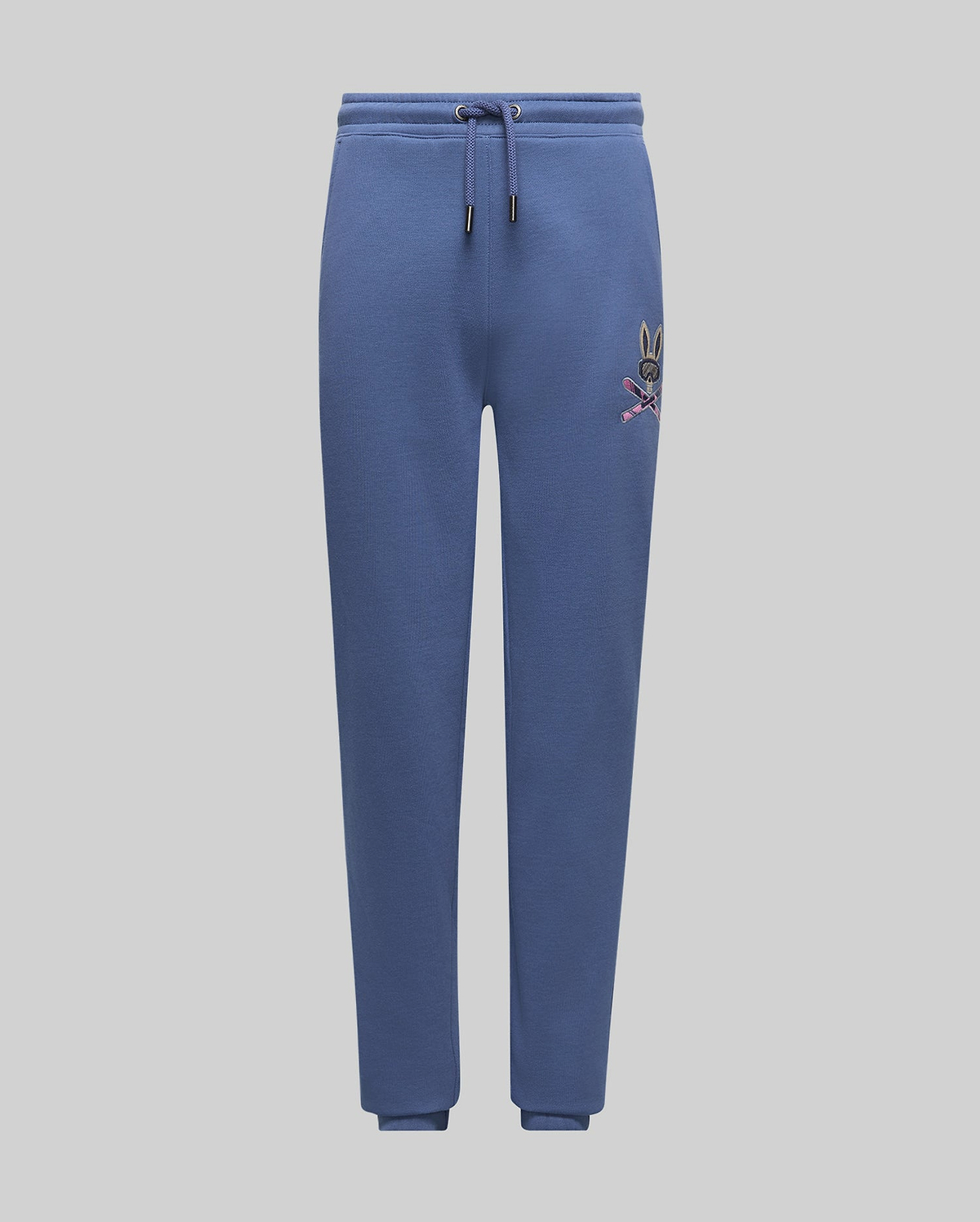 Kids Indigo Ski Bunny Sweatpant, a relaxed fit indigo blue French terry sweatpant featuring a vibrant embroidered Psycho Bunny ski logo on the left thigh and an adjustable drawstring waist.