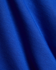 Kids Nathaniel Sweatpant in vibrant royal blue, crafted from a premium, soft jersey knit fabric with a subtle diagonal texture and elegant drape, reflecting refined streetwear quality.