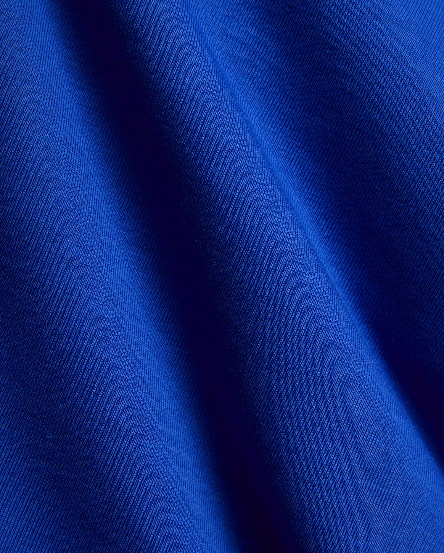 Kids Nathaniel Sweatpant in vibrant royal blue, crafted from a premium, soft jersey knit fabric with a subtle diagonal texture and elegant drape, reflecting refined streetwear quality.
