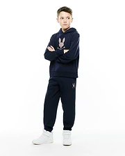 Navy blue relaxed fit hoodie with a large multicolor embroidered Psycho Bunny skull logo on the chest, paired with matching Kids Darcy Sweatpant featuring a small multicolor logo on the left thigh.