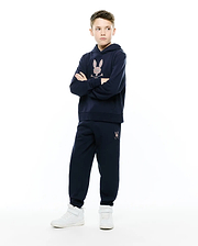 Navy blue relaxed fit hoodie with a large multicolor embroidered Psycho Bunny skull logo on the chest, paired with matching Kids Darcy Sweatpant featuring a small multicolor logo on the left thigh.