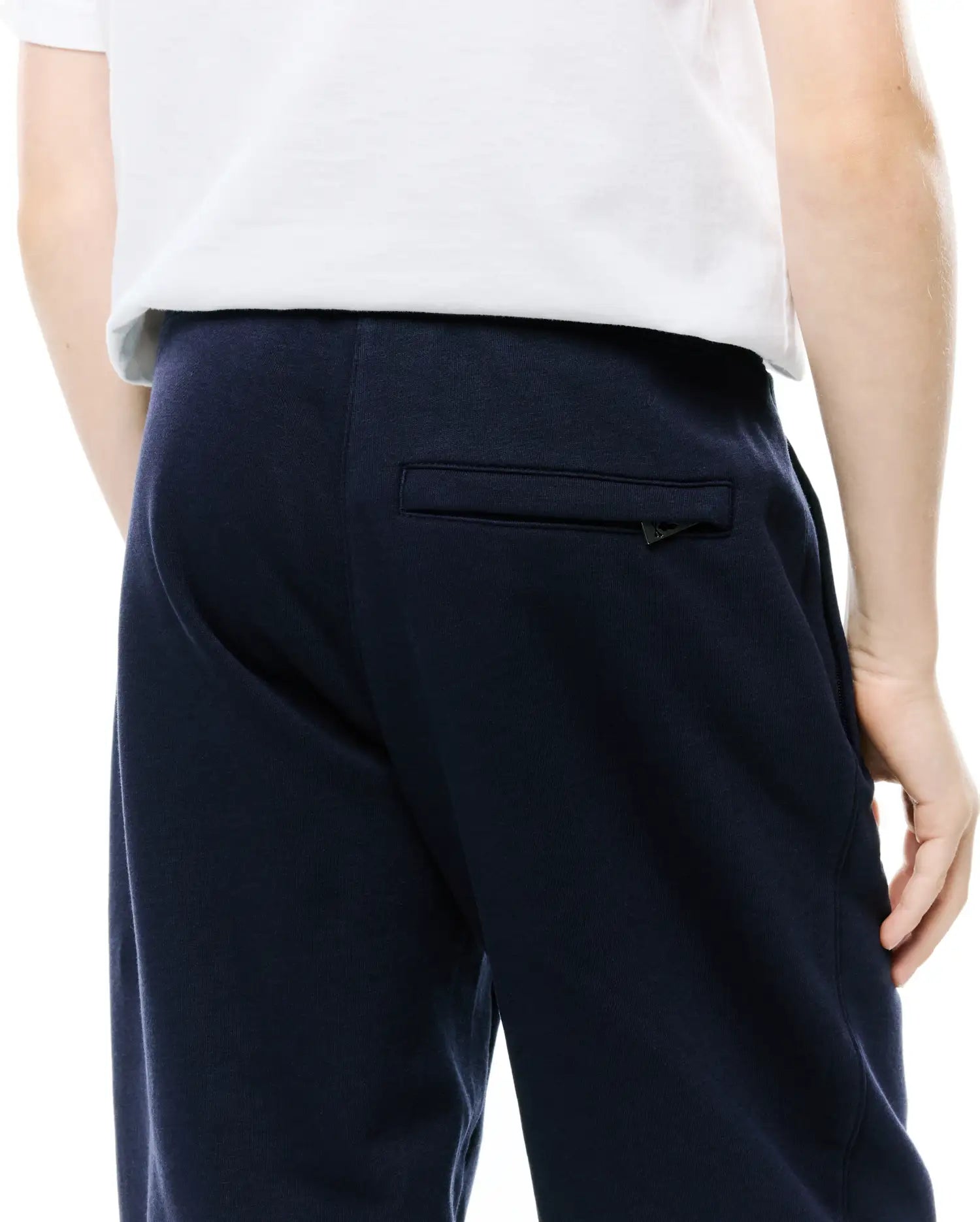 Kids Darcy Sweatpant in navy, crafted from soft French terry fabric. Features a relaxed fit, side pockets, and a back welt pocket with a subtle black pull tab.