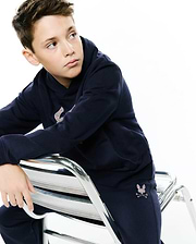 Navy relaxed fit hoodie and KIDS DARCY SWEATPANT in soft French terry, featuring a large multicolor embroidered Psycho Bunny skull logo on the hoodie chest and a smaller one on the left sweatpant thigh.