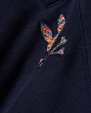 Kids Darcy Sweatpant in deep navy, crafted from soft jersey knit fabric, prominently featuring a medium-sized, intricately embroidered multicolor Psycho Bunny skull logo with a vibrant, woven texture.