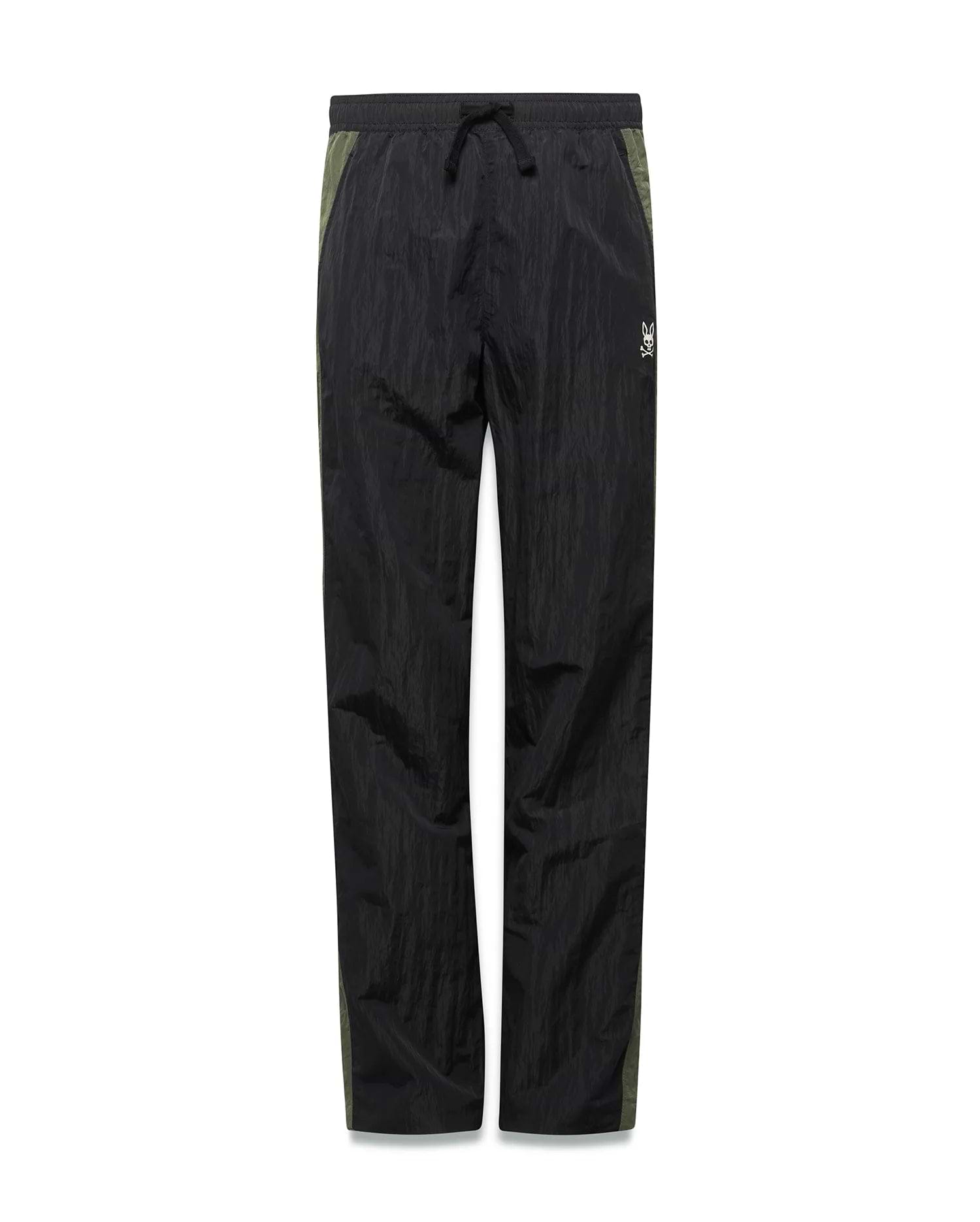 Kids Alder Nylon Colorblock Pant in black crinkled nylon with olive green side panels, featuring a relaxed fit and a small white Psycho Bunny skull logo on the right hip.