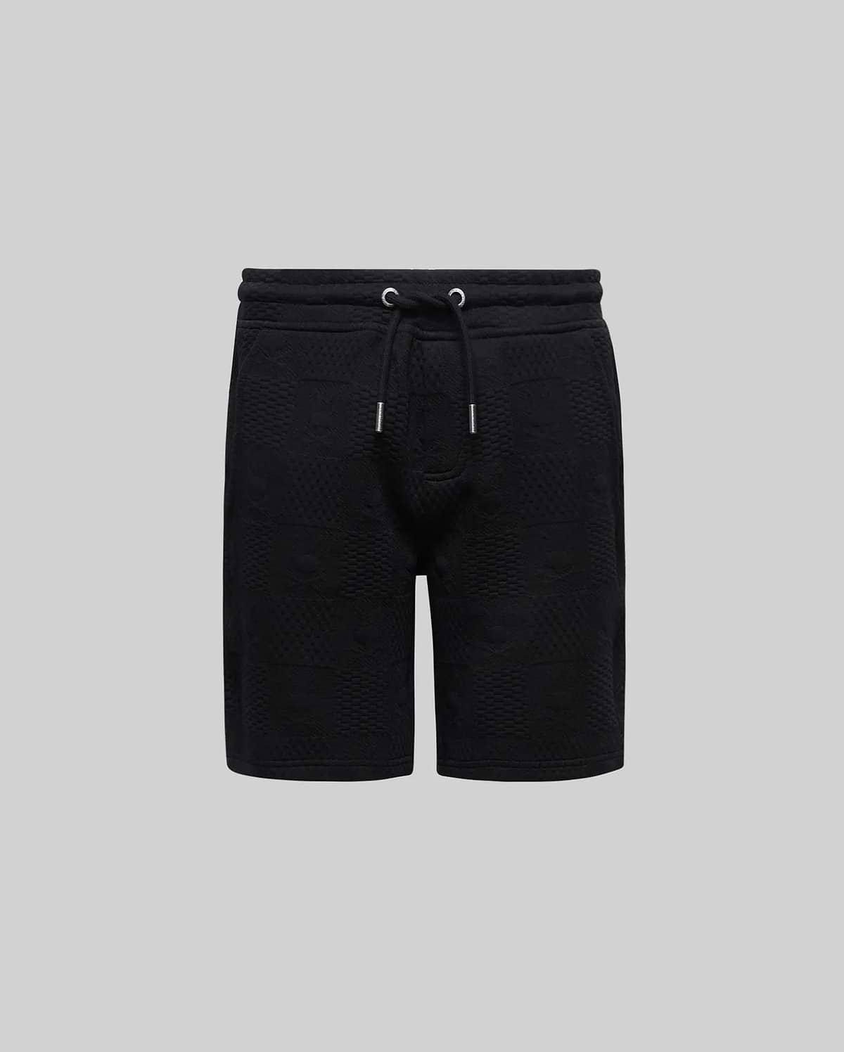 Kids Dustin Sweatshort, a black relaxed fit french terry short featuring an all-over embossed checkerboard pattern and an adjustable drawstring waist with silver tips, from Psycho Bunny.