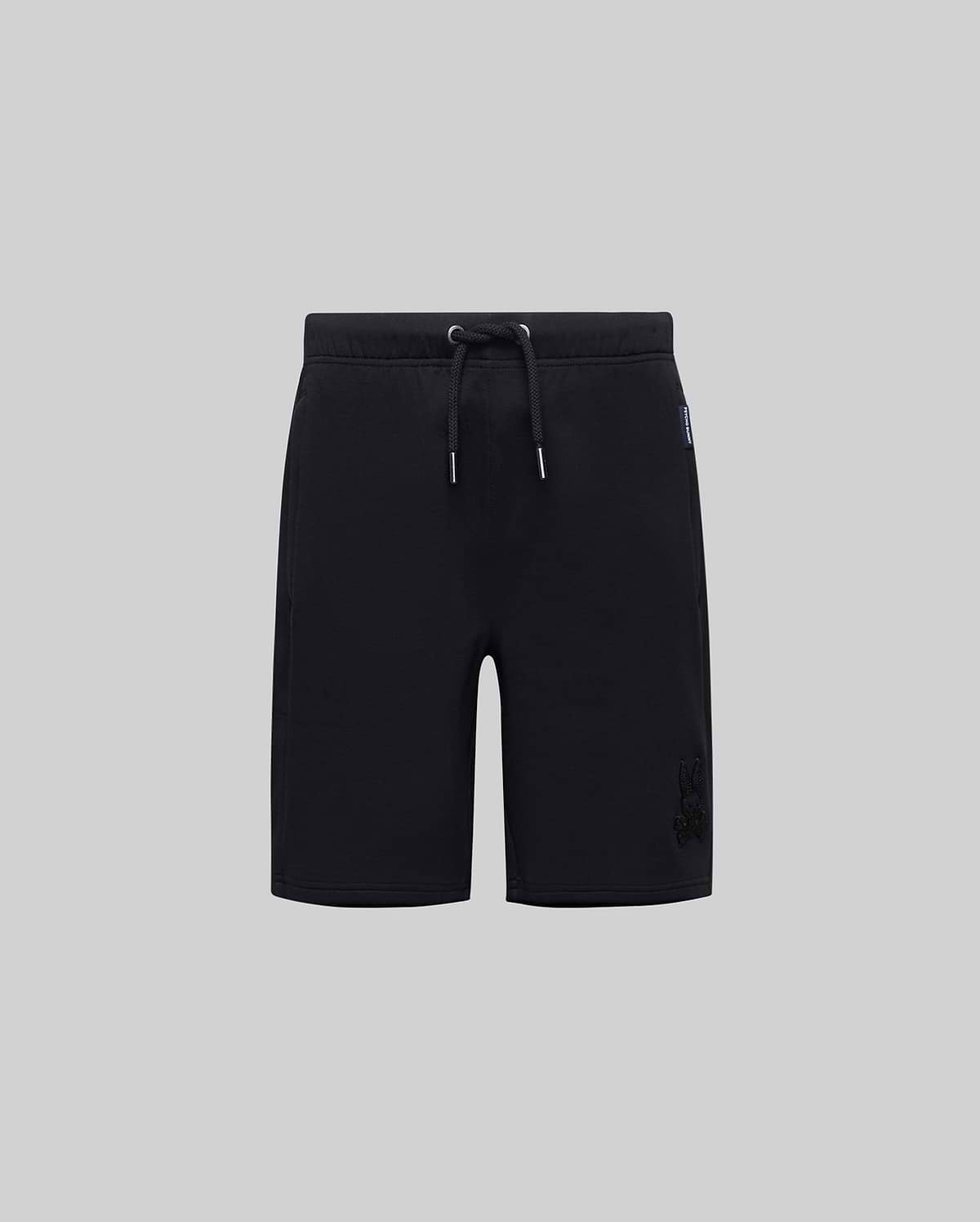 Kids Barry Modal Short, black jersey shorts with a relaxed fit, featuring a tonal embroidered Psycho Bunny skull logo on the right leg and a blue Psycho Bunny side tag.