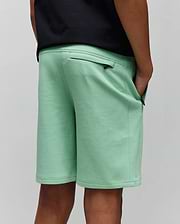 Kids Barry Modal Short, mint green, relaxed fit, soft modal blend fabric, featuring zippered back and side pockets with small black Psycho Bunny skull logo zipper pulls.