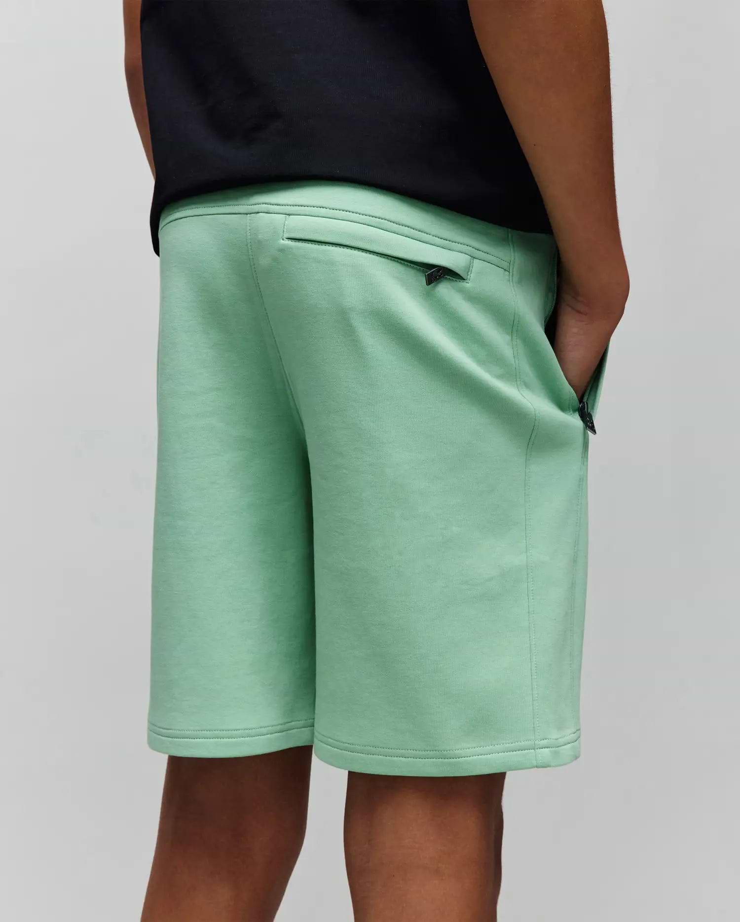 Kids Barry Modal Short, mint green, relaxed fit, soft modal blend fabric, featuring zippered back and side pockets with small black Psycho Bunny skull logo zipper pulls.