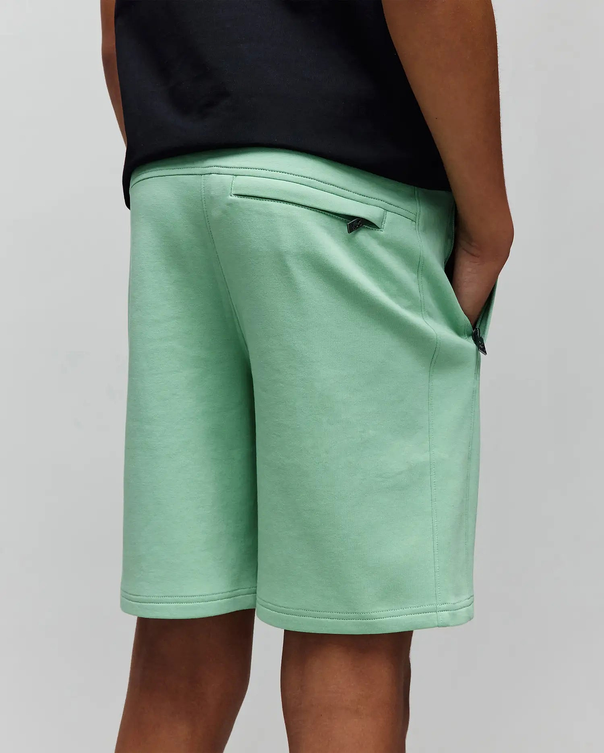 Kids Barry Modal Short, mint green, relaxed fit, soft modal blend fabric, featuring zippered back and side pockets with small black Psycho Bunny skull logo zipper pulls.