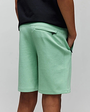 Kids Barry Modal Short, mint green, relaxed fit, soft modal blend fabric, featuring zippered back and side pockets with small black Psycho Bunny skull logo zipper pulls.