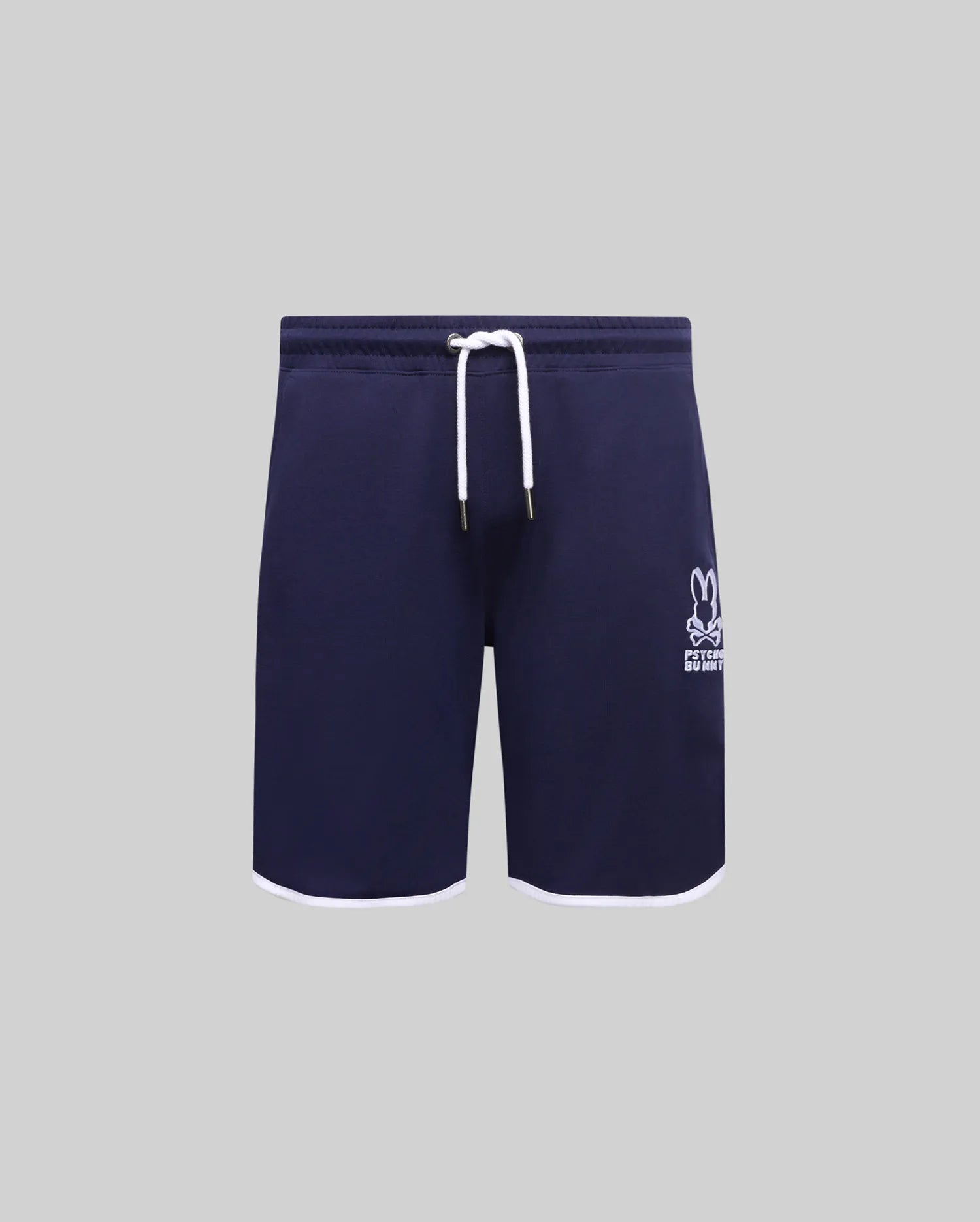 Kids Toby Short, navy French terry with white drawstring, gold tips, and white hem trim. Features an embroidered white Psycho Bunny skull logo on the right thigh.